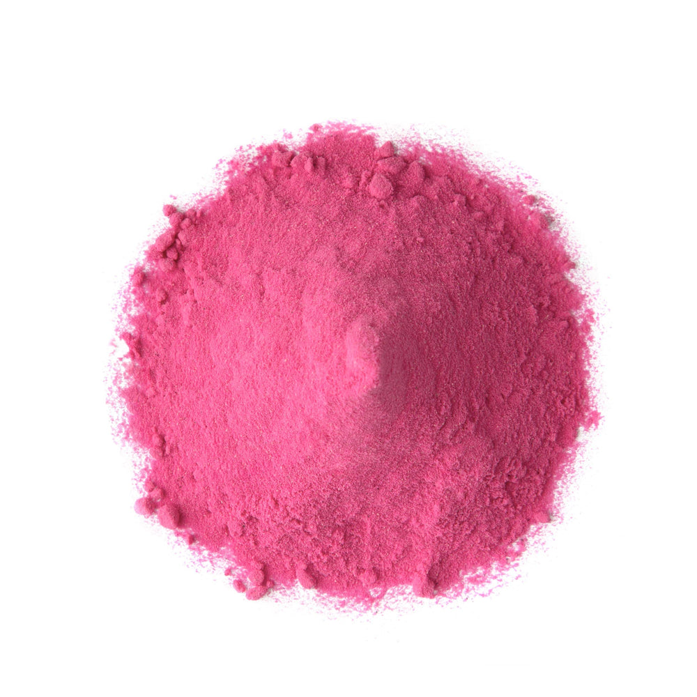 Food to Live dragon fruit powder being poured into a glass