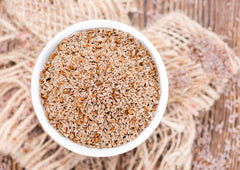Food to Live Psyllium Seeds close-up, raw texture of tiny seeds.
