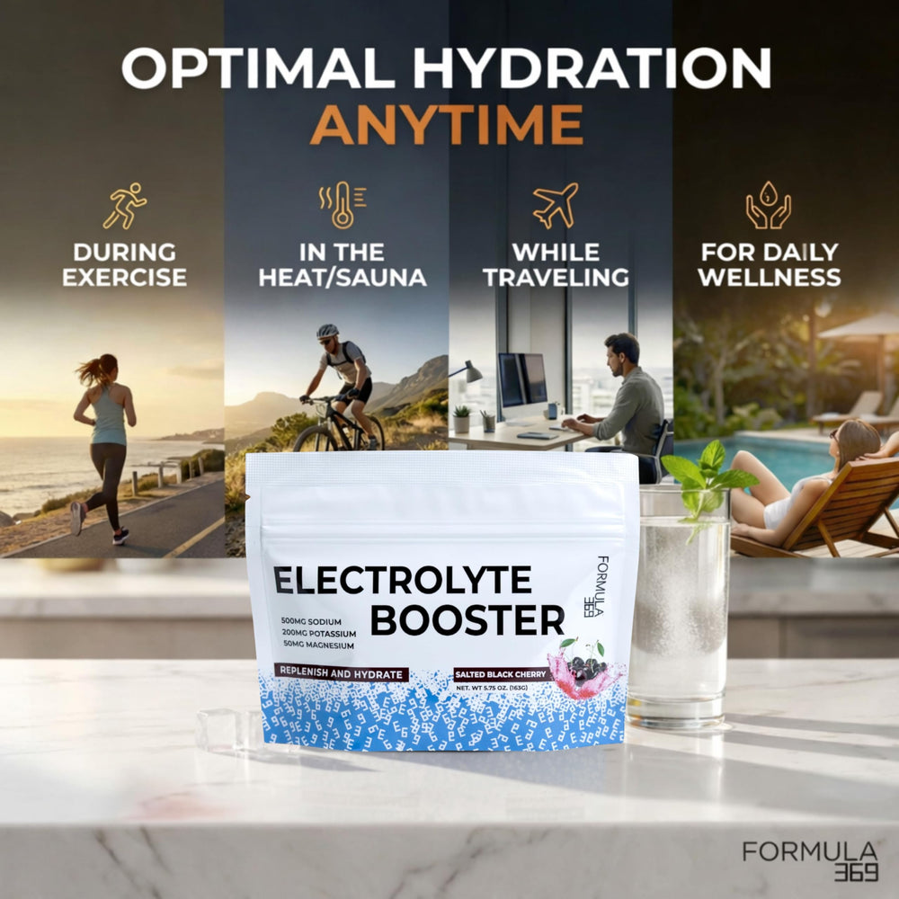 Scoop of Formula 369 electrolyte powder beside a glass for at-home workouts.