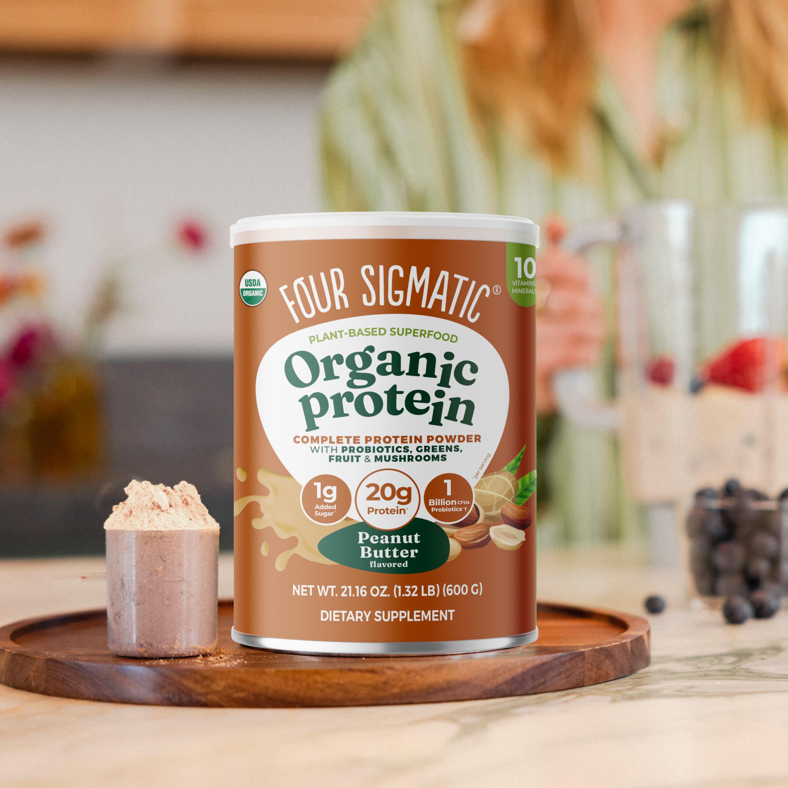 Four Sigmatic protein powder packaging shows recyclable container.