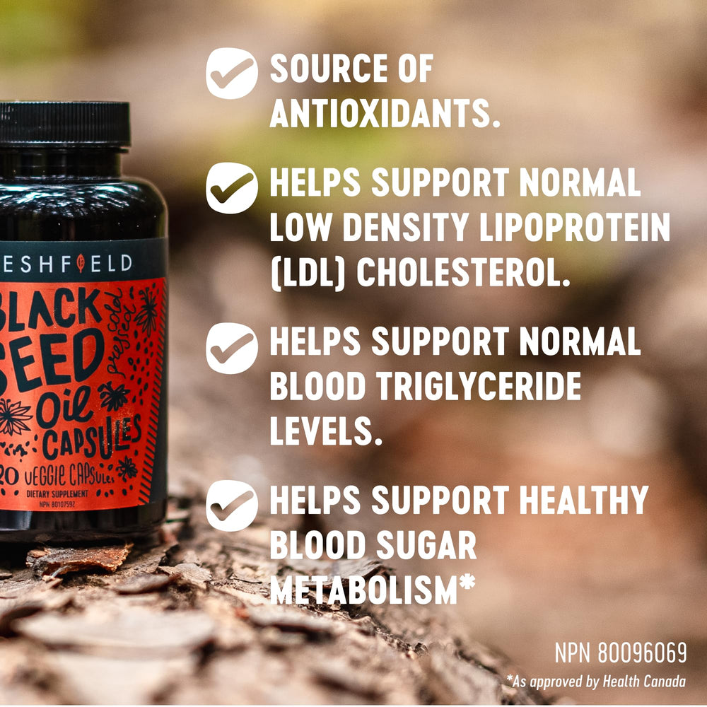 Freshfield black seed oil capsules bottle back label lists ingredients and vegan certification.