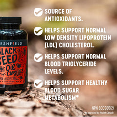 Freshfield black seed oil capsules bottle back label lists ingredients and vegan certification.