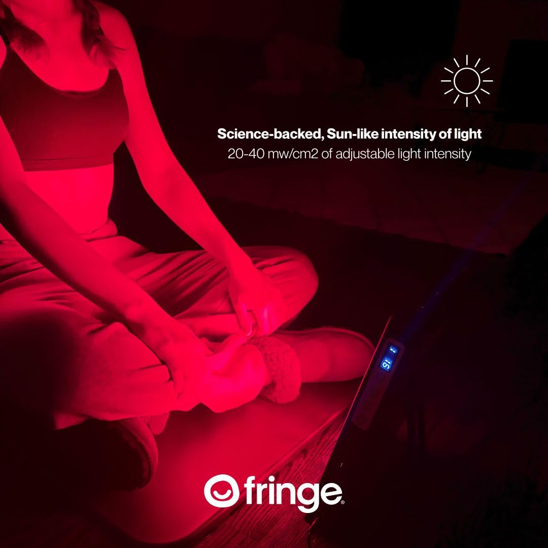 Fringe Red Light Panel in-use over leg muscles for post-workout recovery.