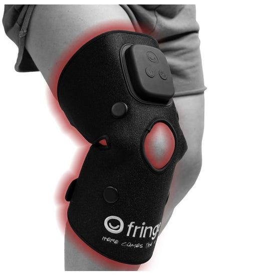 Fringe red light wrap on knee for targeted joint therapy and comfort.
