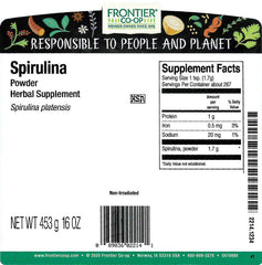 Frontier Spirulina Powder being poured, ideal for adding greens to drinks.