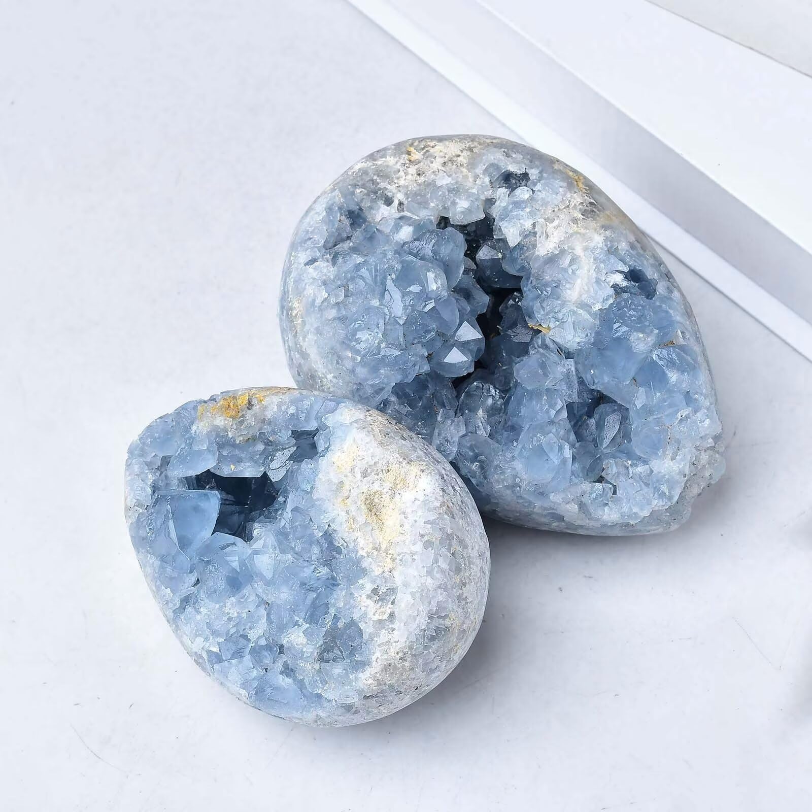 Side view of FZBHRO blue celestite geode egg for visual depth.