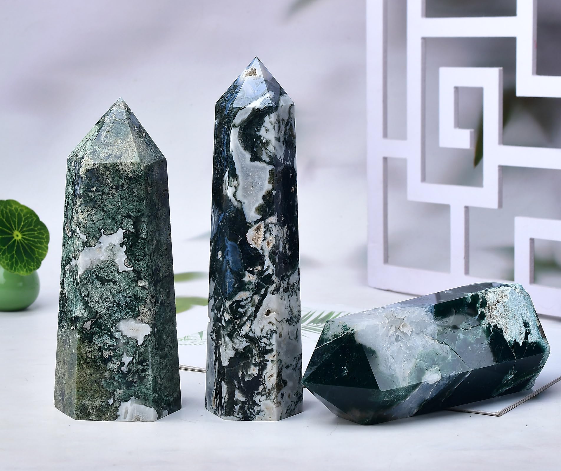 FZBHRO green crystal point close-up shows vivid banding ideal for calming rituals.