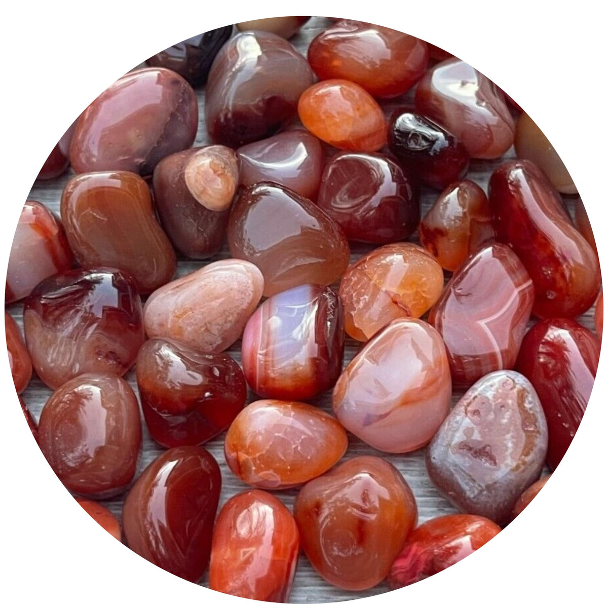 GAF TREASURES Carnelian tumbled stones close-up highlighting vibrant color for creativity