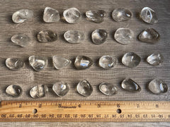 GAF TREASURES clear quartz tumbled stones – light-catching surfaces for mindful practice.