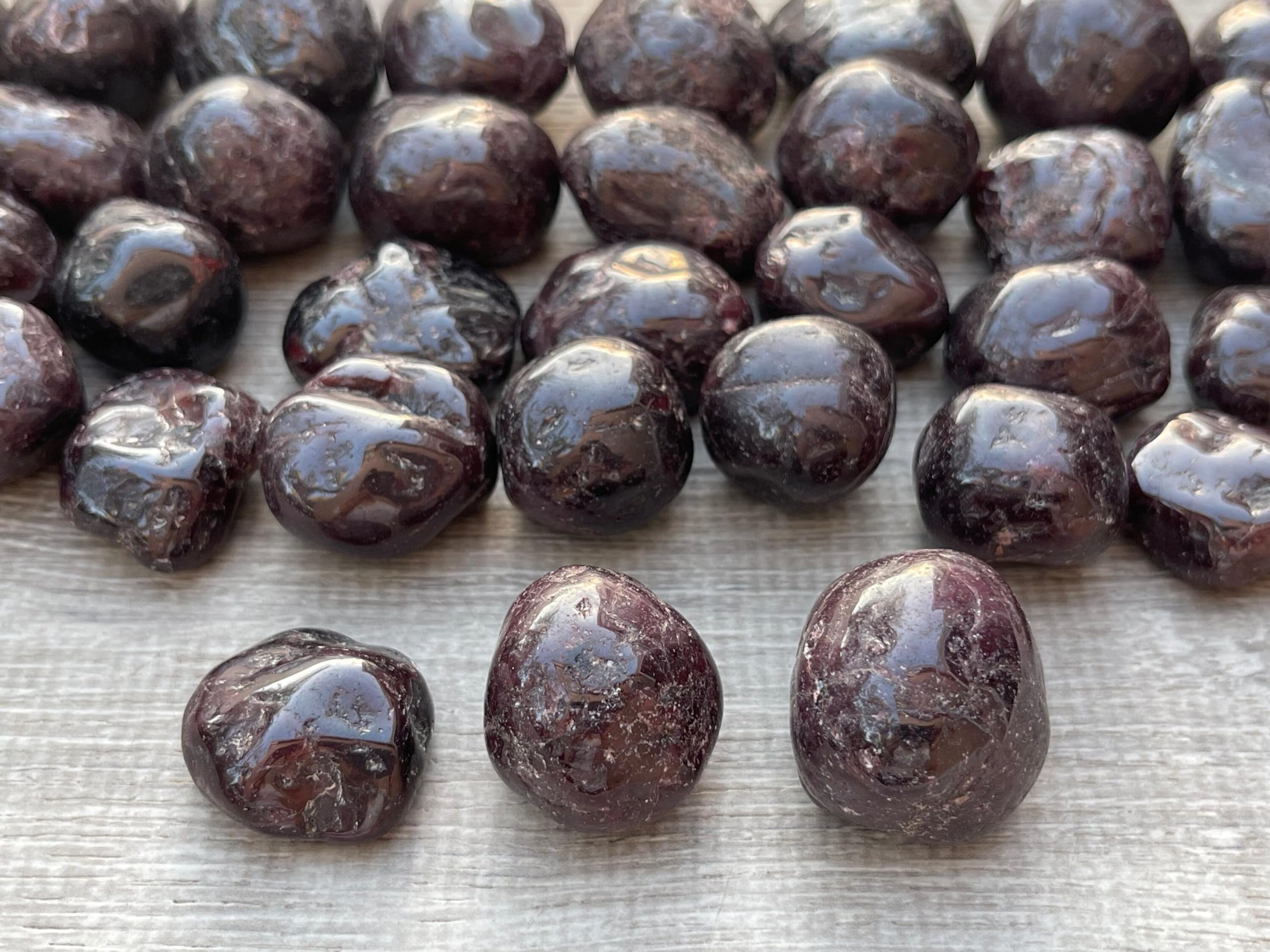 GAF TREASURES Garnet Palm Stone: tactile palm stone for calming sessions and confidence boosts.