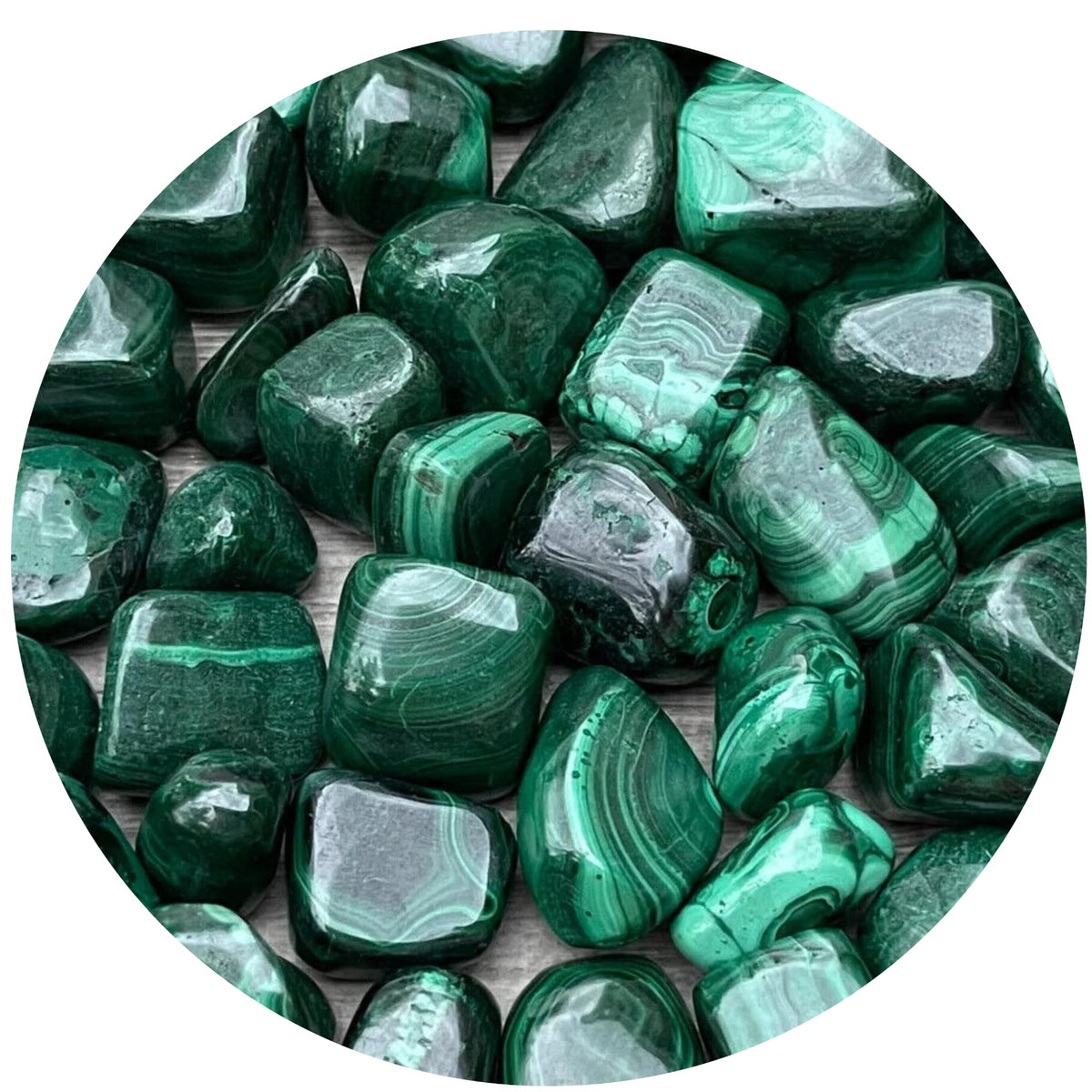 GAF TREASURES Malachite tumbled stones closeup showing vibrant green banding for meditation use