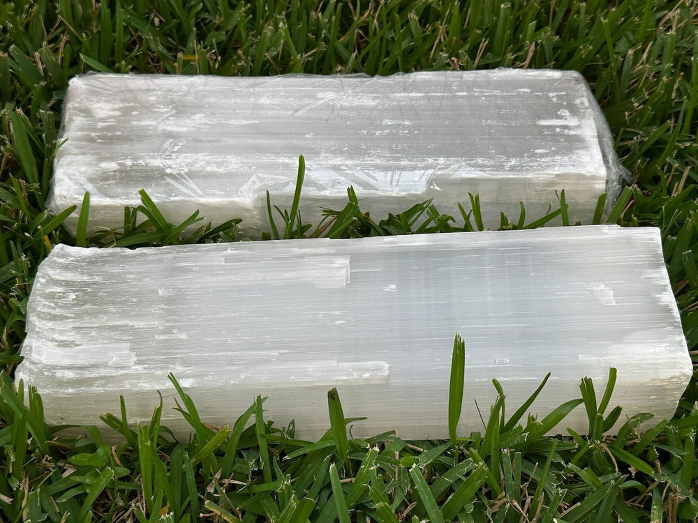 GAF TREASURES natural white selenite log closeup — milky glow and crystalline texture.