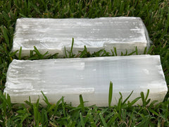 GAF TREASURES natural white selenite log closeup — milky glow and crystalline texture.