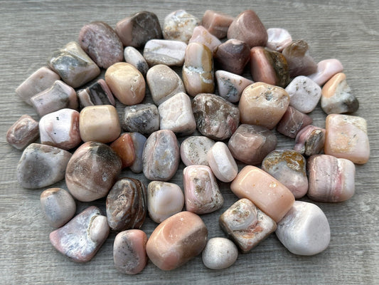 GAF Treasures Pink Opal tumbled stones in hand ideal for pocket carry and calming focus