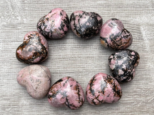 GAF Treasures Rhodonite Heart closeup showing pink hues and smooth polish for calm tactile use