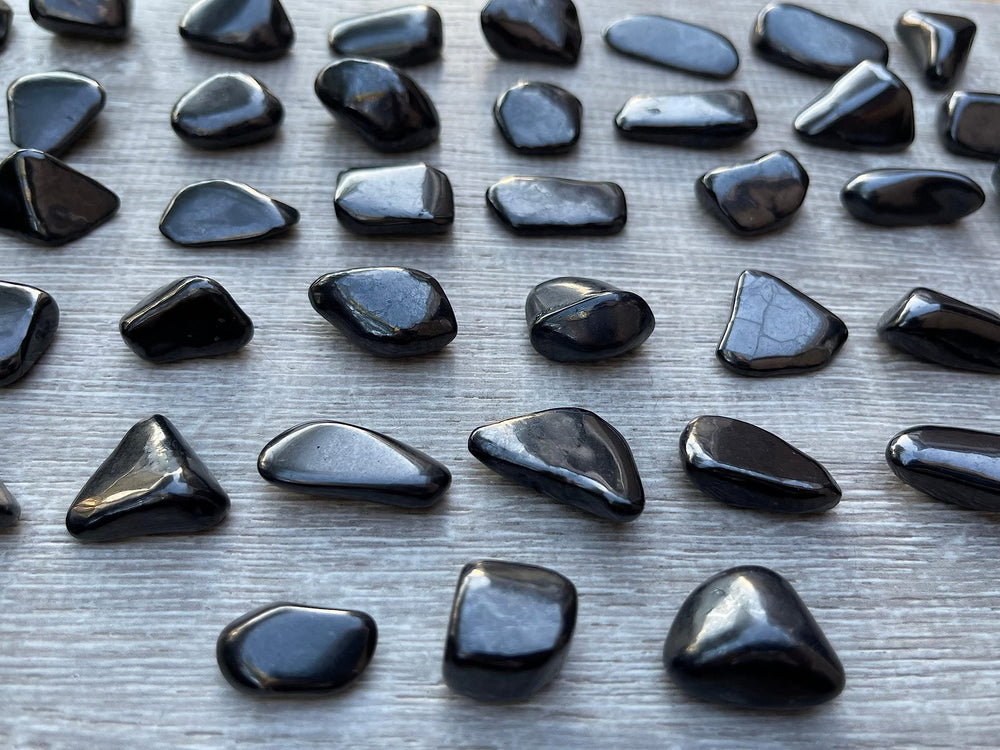 GAF TREASURES Shungite stones sized 0.75–1.25 inches for display.