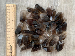 GAF TREASURES smoky quartz point grid-work accessory promotes mindful spaces.