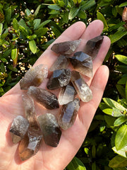 GAF TREASURES Smoky Quartz Point pile view highlights natural variation and earthy appeal