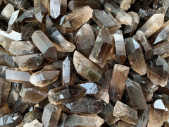 GAF Treasures smoky quartz point rough stone shows natural variations in color and pattern.