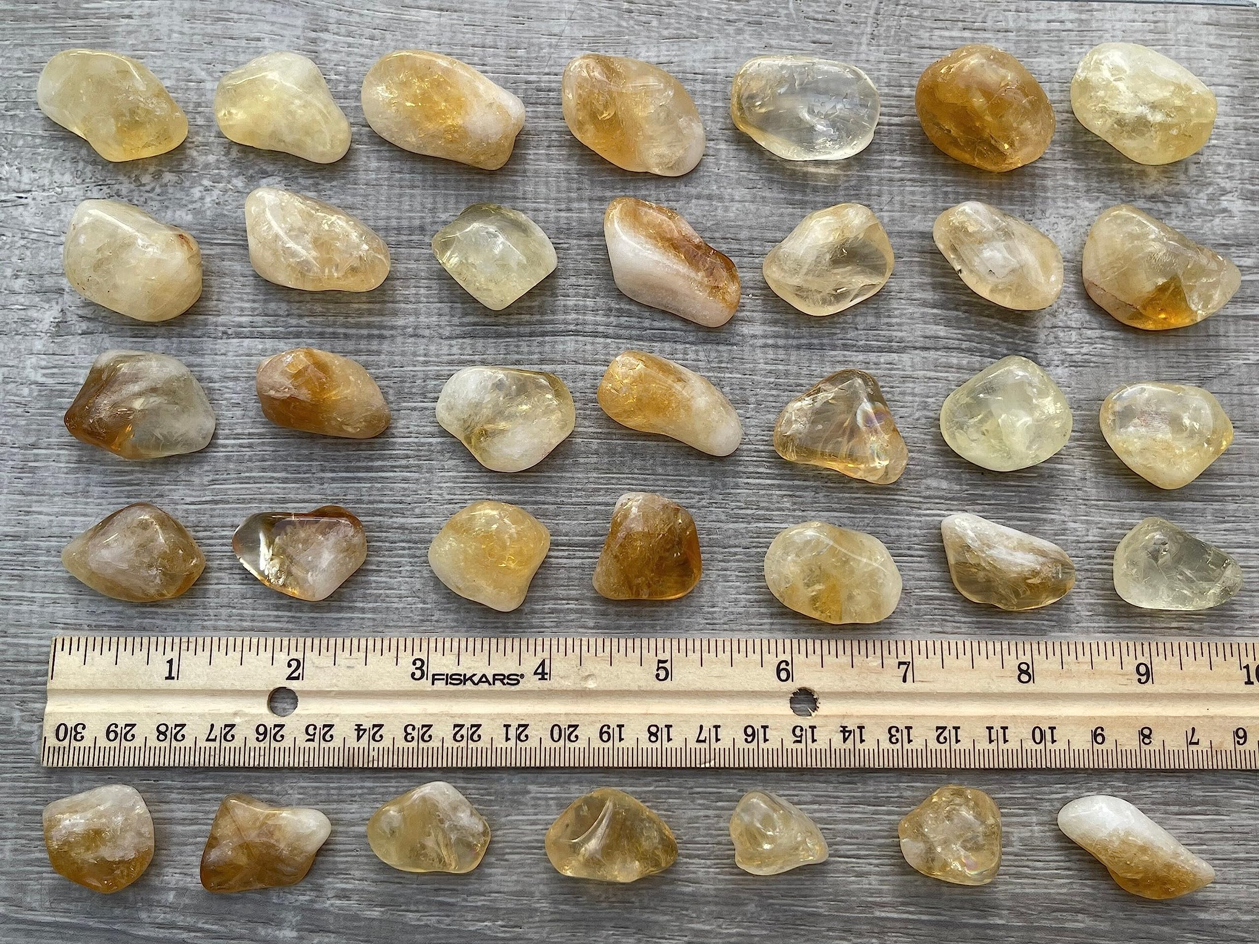 GAF TREASURES Display-ready citrine tumbled stones for home decor.
