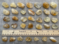 GAF TREASURES Display-ready citrine tumbled stones for home decor.