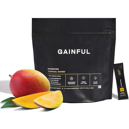 Gainful Hydration Tropical Mango packet dissolving in water for quick hydration.