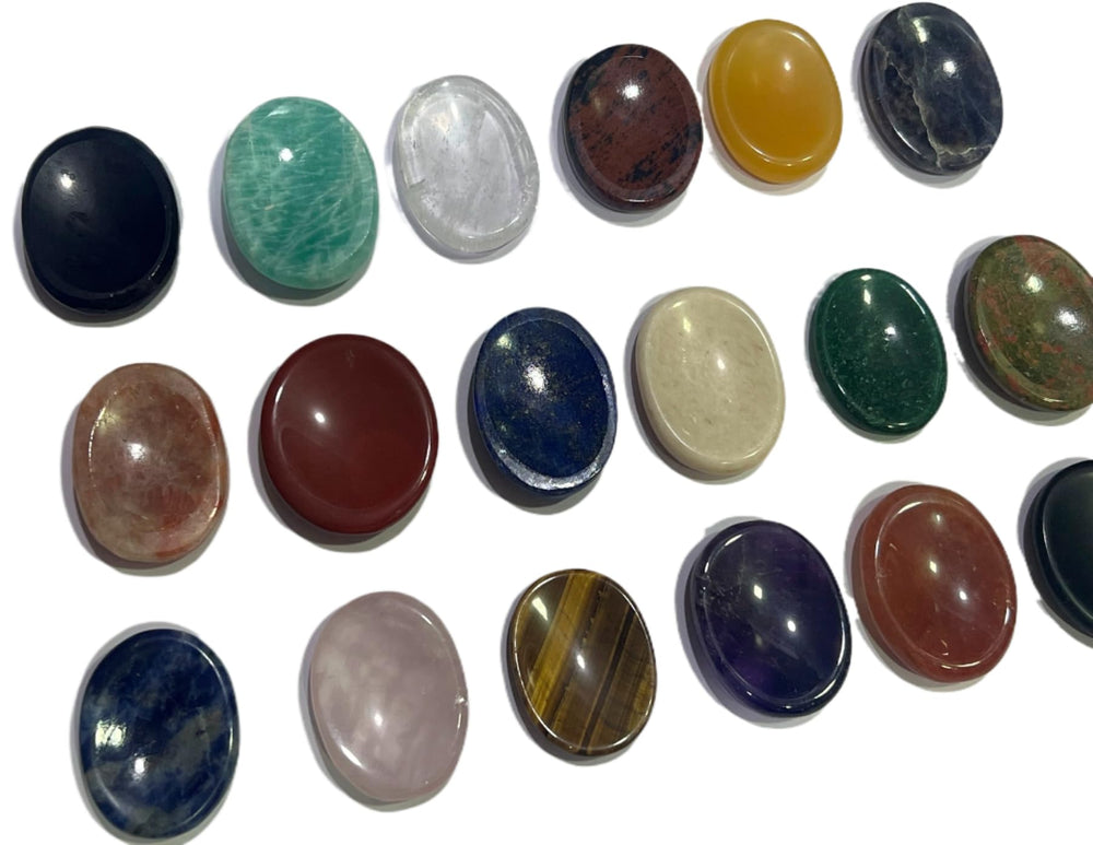 GEMSCITE worry stone held in hand for tactile relaxation and focus.