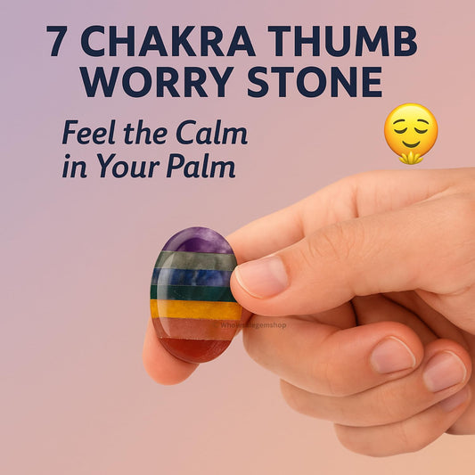 GEMSCITE thumb-indent close-up on a smooth worry stone for calming energy.