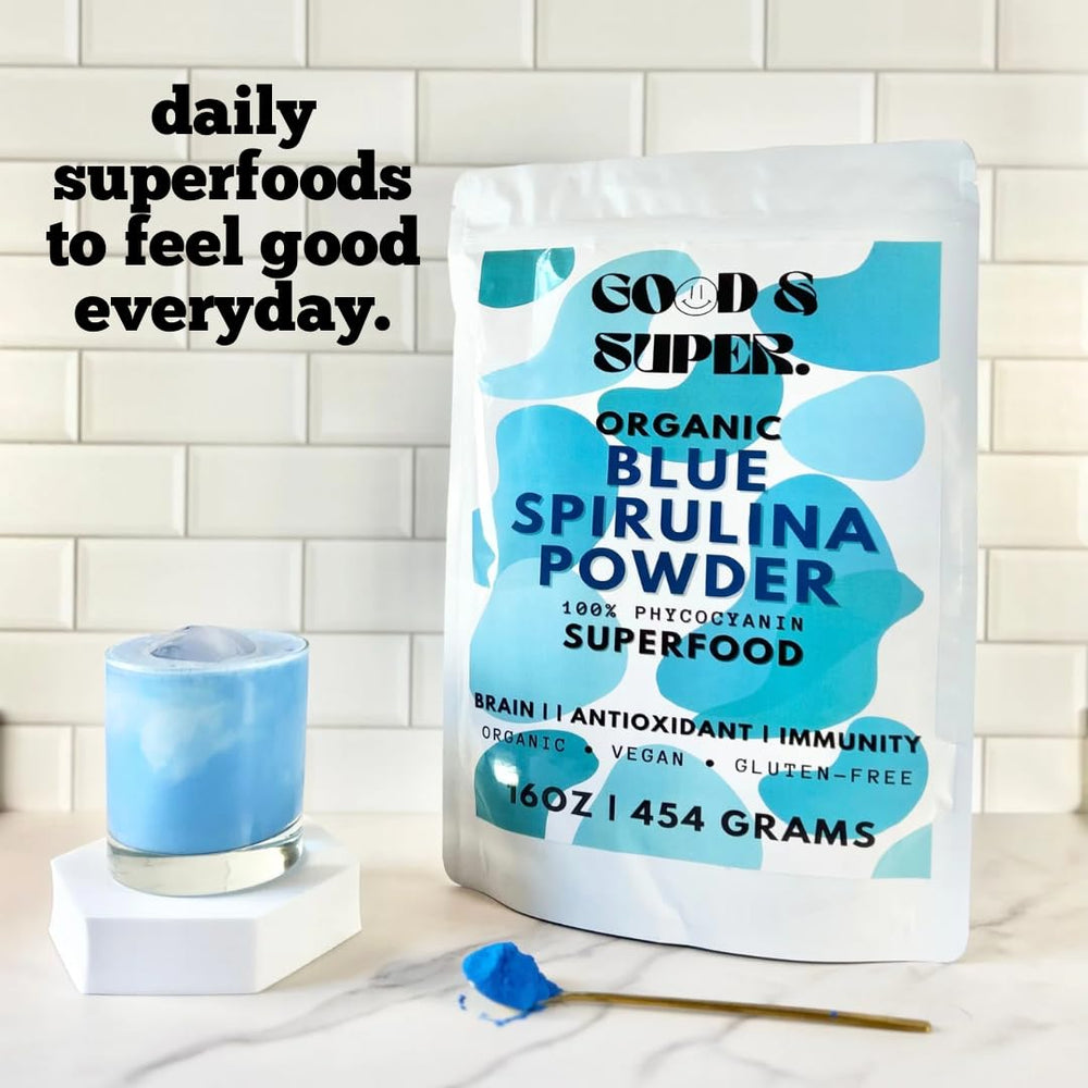 Pouring from a jar of Generic Blue Spirulina Powder for drinks.
