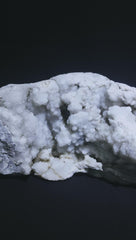 Generic Okenite Druzy Crystal Cluster on a meditation altar for focus.