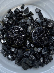 Generic Shungite Elite Noble tower buster on display stand anchors space energy.