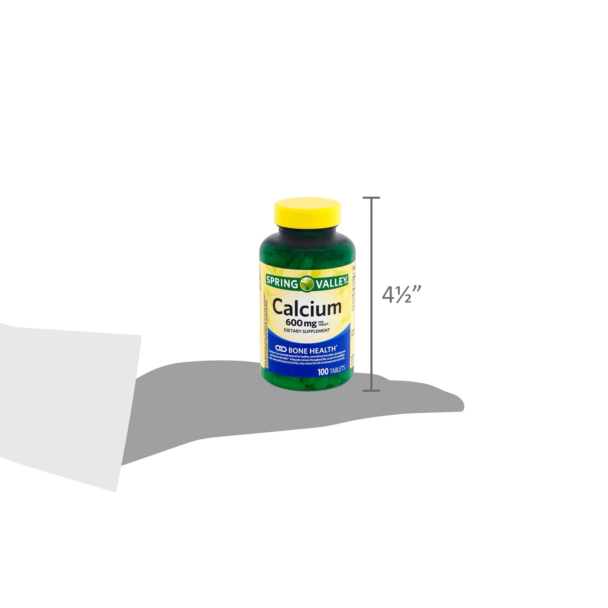 Product display of Generic Spring Valley Calcium 600mg bottles on a shelf.