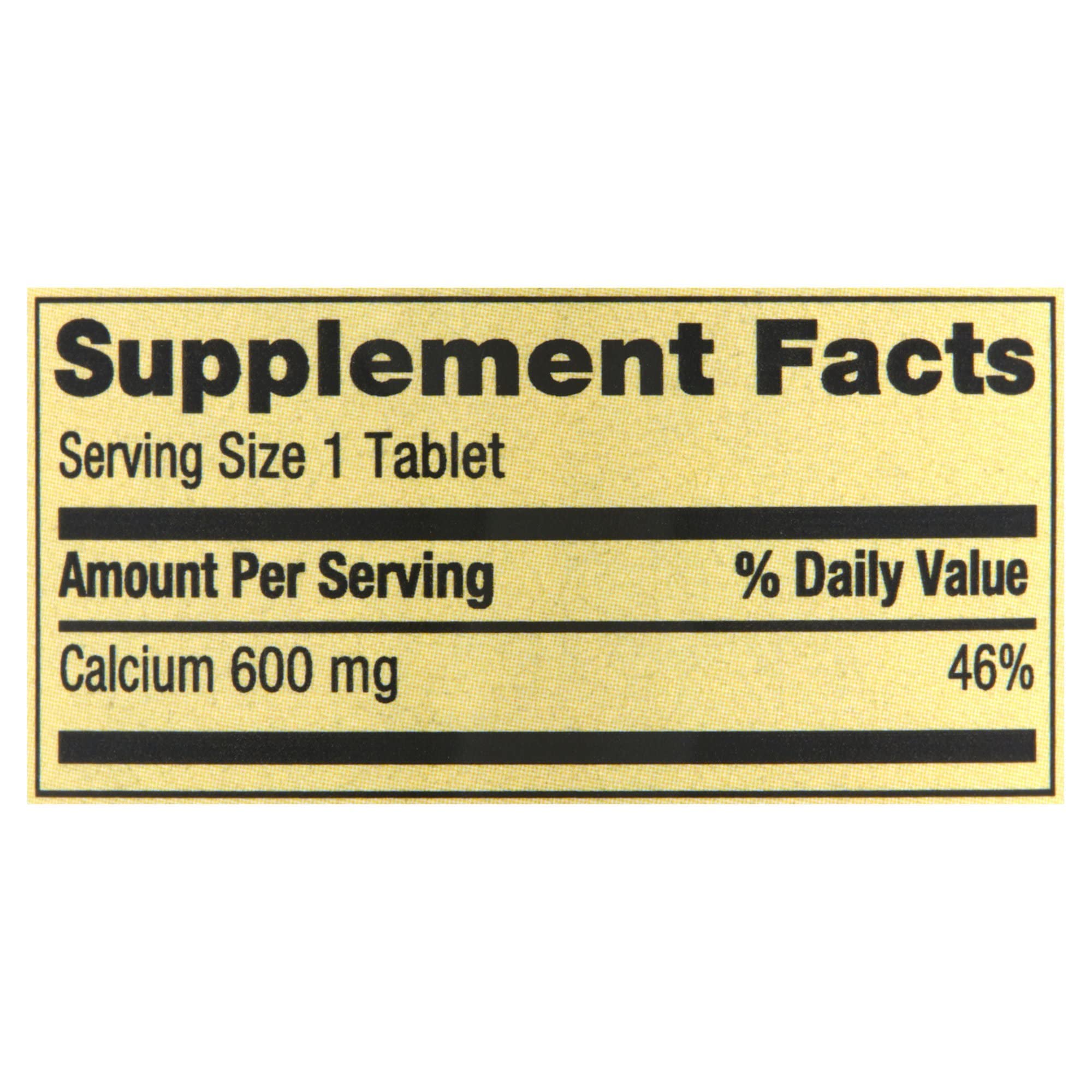 Generic Spring Valley Calcium 600mg bottle being poured into a glass.