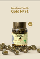 Close-up of Generic Wax Green Propolis N91 Gold capsules showing oil-rich interior