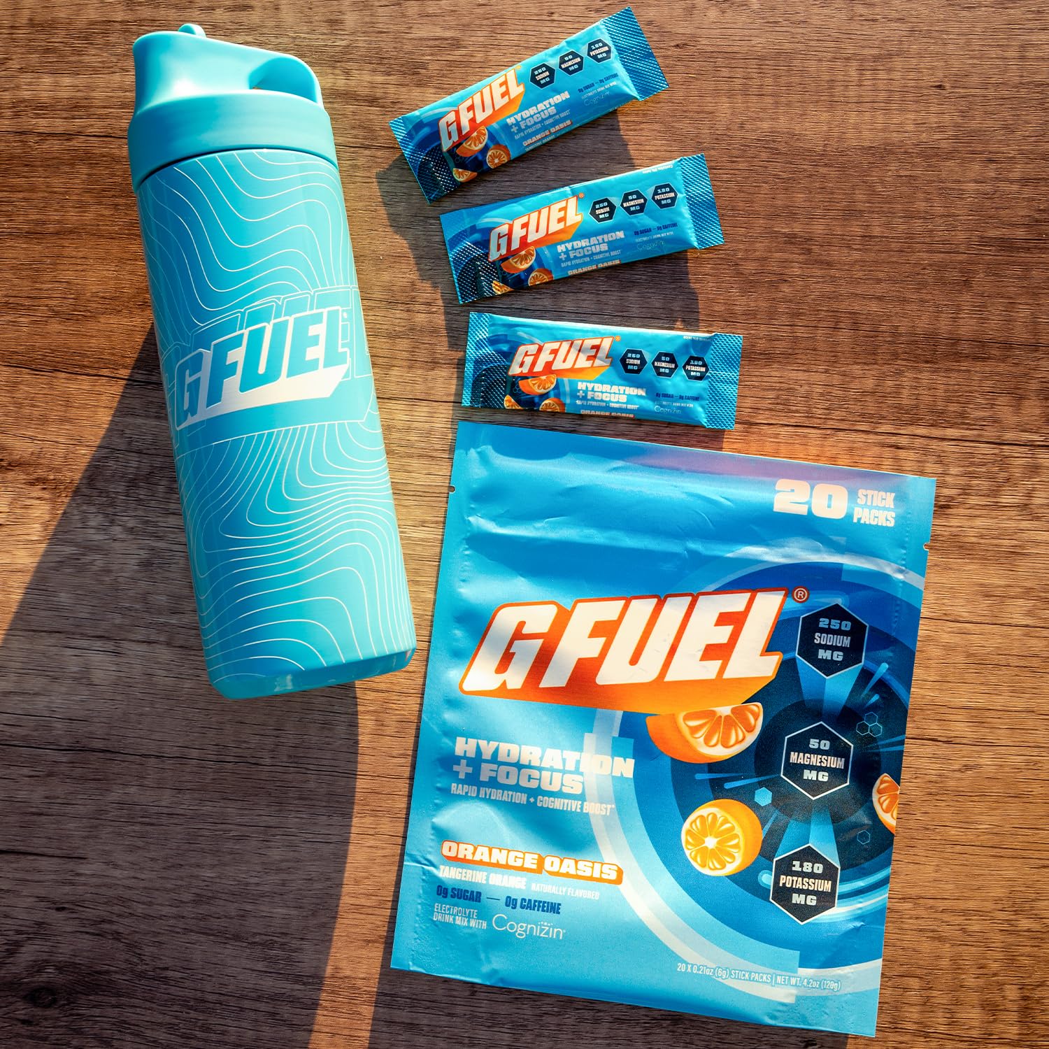 G Fuel Electrolytes Orange Oasis scoop beside tub for easy serving.