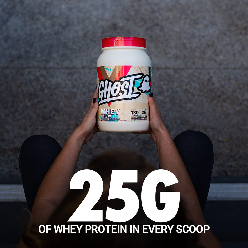 Ghost Whey Milk Chocolate shake in glass, perfect for athletic recovery.