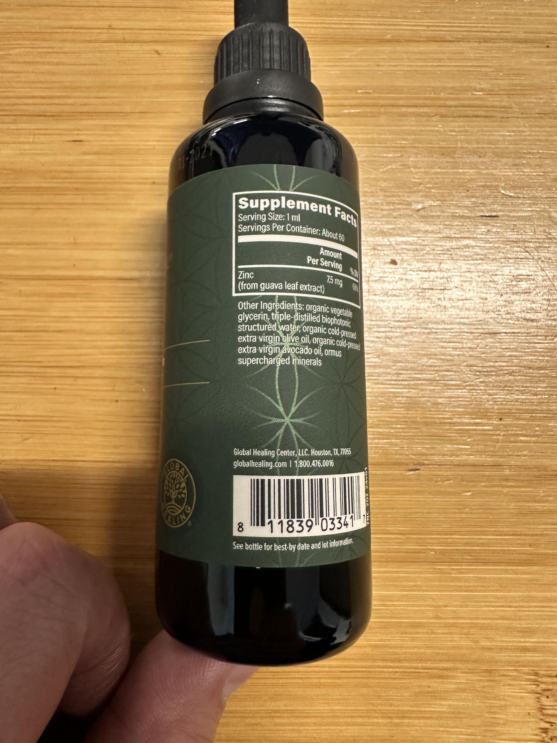 Global Healing Center zinc liquid with guava leaves illustration hints natural ingredients.