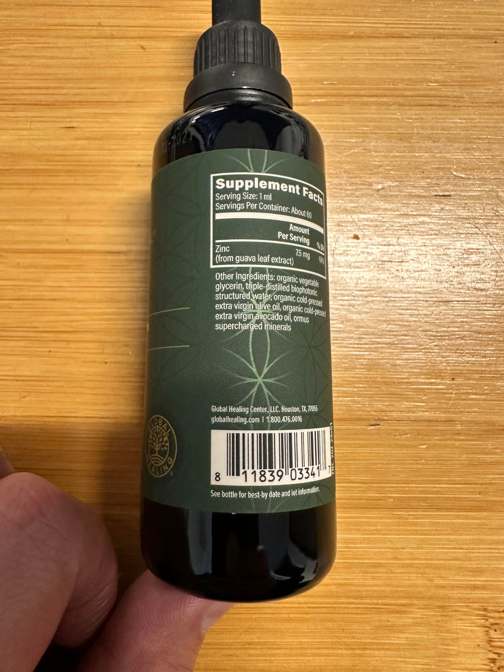 Global Healing Center zinc liquid with guava leaves illustration hints natural ingredients.
