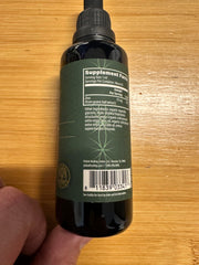Global Healing Center zinc liquid with guava leaves illustration hints natural ingredients.