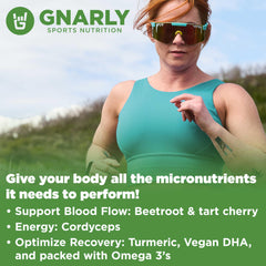 Gnarly Nutrition Greens Blueberry Acai powder being poured into a glass for easy mixing.