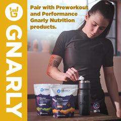 Gnarly Nutrition vanilla protein powder packaging flat lay highlighting grass-fed source.