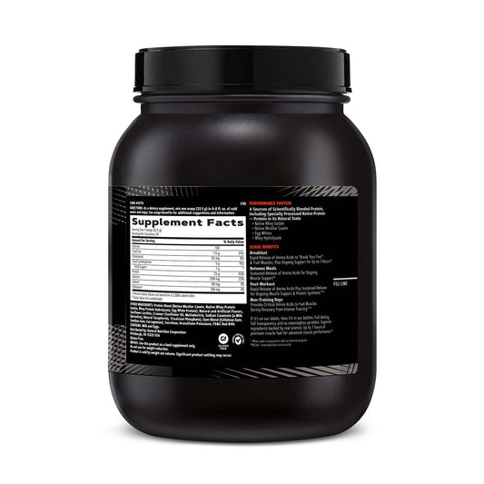 GNC AMP Sustained Cinnamon Toast scoop beside the bottle for post-workout recovery.