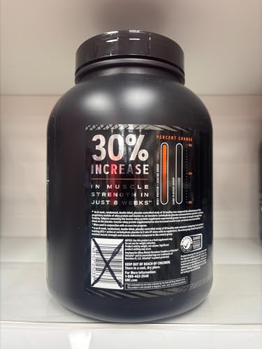 GNC AMP Wheybolic coconut caramel bag and packaging on desk