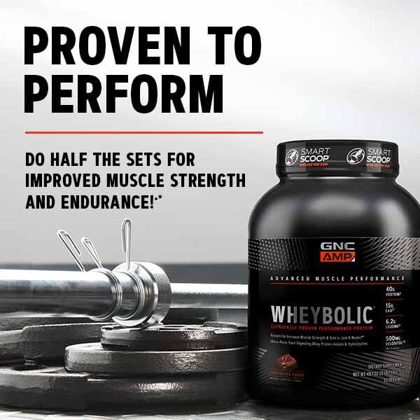 GNC AMP Wheybolic flavor strawberries and cream in serving cup.