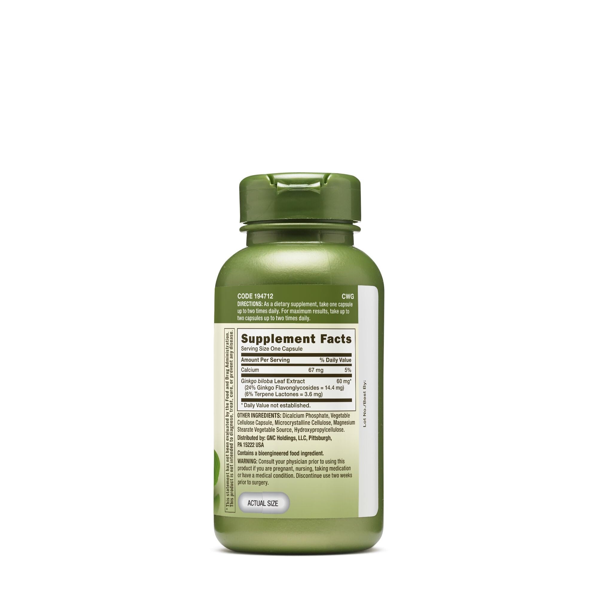 Close-up of GNC capsules emphasizes vegetarian formula for daily concentration.