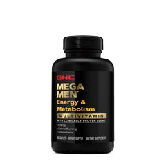 GNC Mega Men Energy and Metabolism bottle on desk beside gym equipment