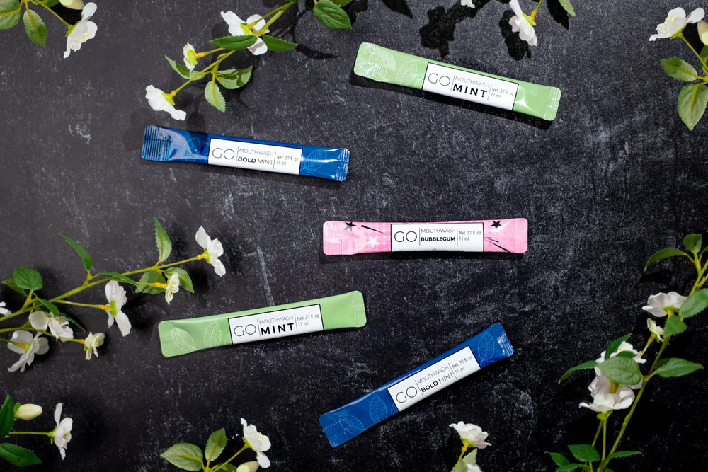 Go Mouthwash Bold Mint spill-proof packet demonstrates mess-free travel hydration and airport convenience.