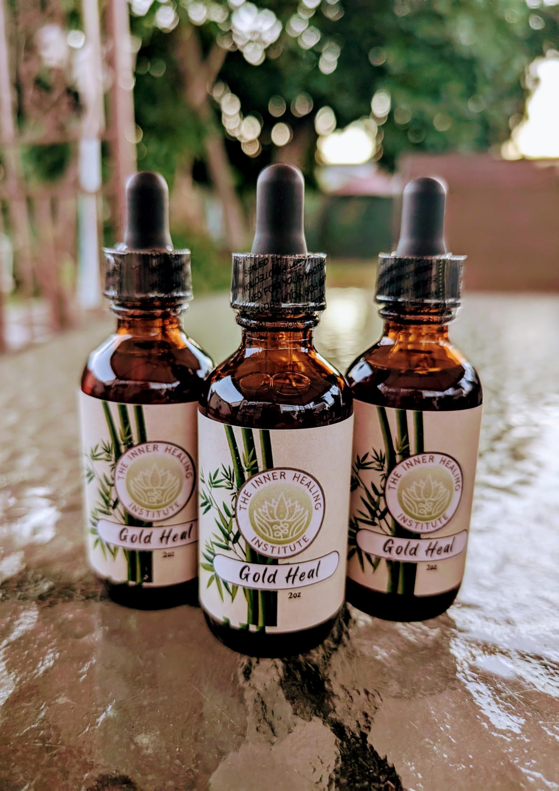 Gold Heal drops ready for easy mixing into juice for daily use.