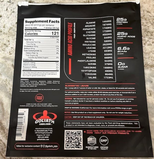 Goliath Labs whey powder scoop beside the tub for quick servings.