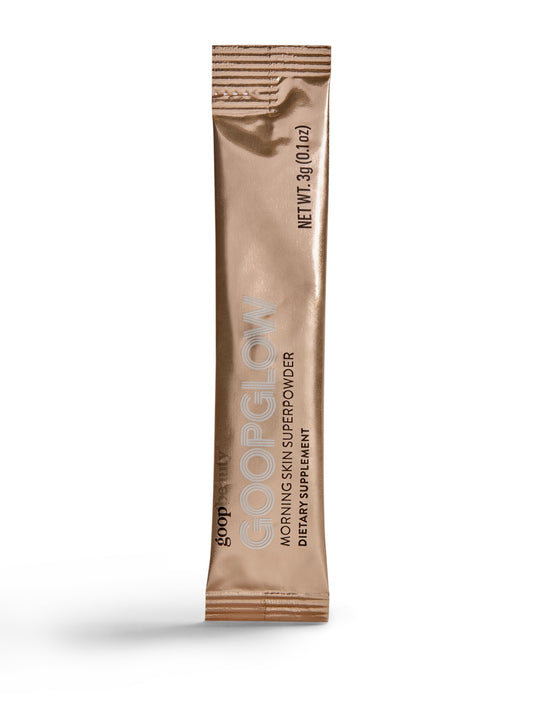 Goop Beauty Morning Skin Drink Mix bottle pouring into glass for a vitamin-rich refreshment.